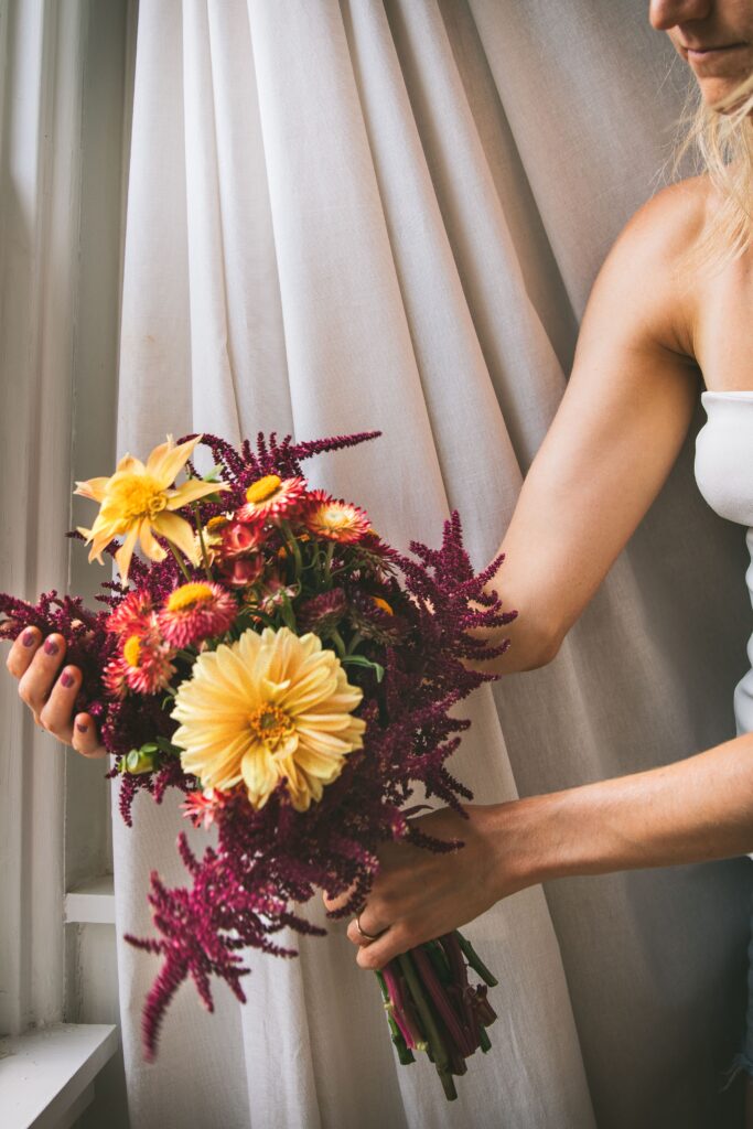 hand holding a bouquet of locally sourced Pittsburgh flowers